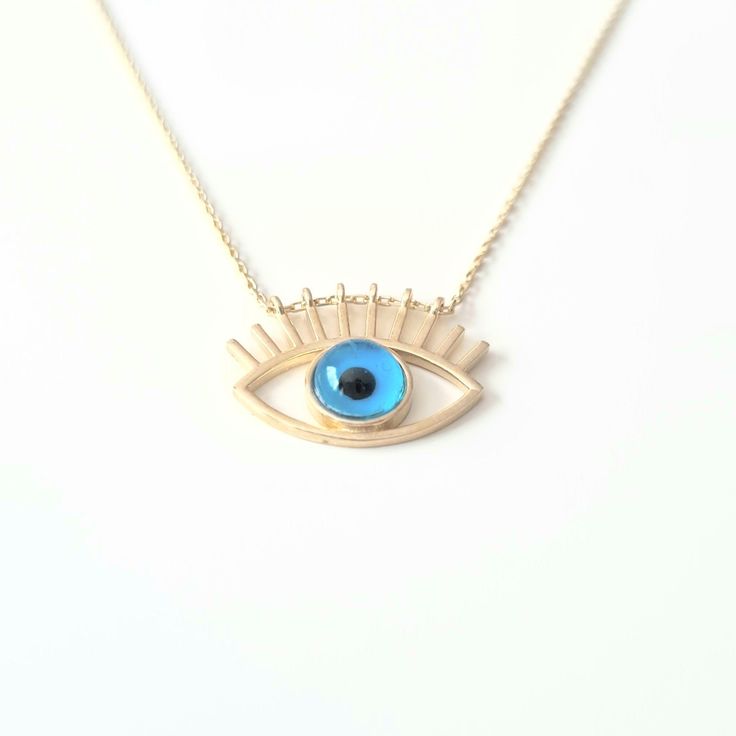 - Eye Evil Eyelash Pendant Necklace is made with high quality 14K real solid yellow gold. - Eye Evil Eyelash Pendant Necklace for women is decoreted with blue evil eye Stone. Evil Eyes are also called Turkish Greek Evil Eye, Faith Protection and Nazar. - This cute, charm, dainty, delicate, elegant women jewelry Eye Evil Eyelash Pendant Necklace has been artfully designed for timeless yet modern millennial fashion. - You receive the necklace in a beautiful and free gift box - Free shipping (Arriv 14k Gold Evil Eye Jewelry Gift, Blue Sterling Silver Jewelry For Celebration, Celebration Blue Sterling Silver Jewelry, Blue Spiritual Gold-plated Necklaces, Blue Pendant Necklace For Celebration, Blue Pendant Necklace In 14k Gold, Blue 14k Gold Pendant Necklace, Blue 14k Gold Pendant Jewelry, Handmade 14k Gold Blue Jewelry