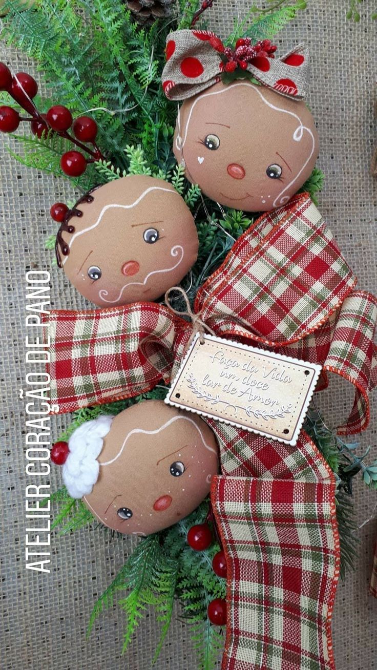 three christmas ornaments are sitting on the ground