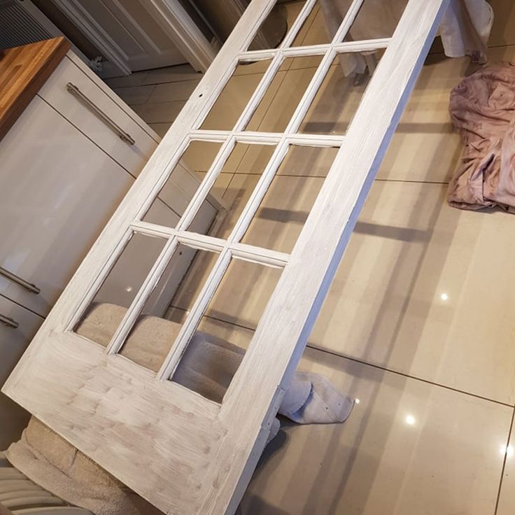 an open window sitting on top of a kitchen floor