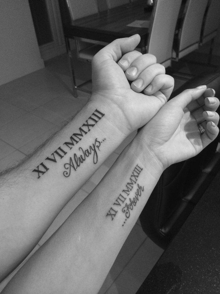 two people are holding hands with tattoos on their arms and the words, my ultimate memory