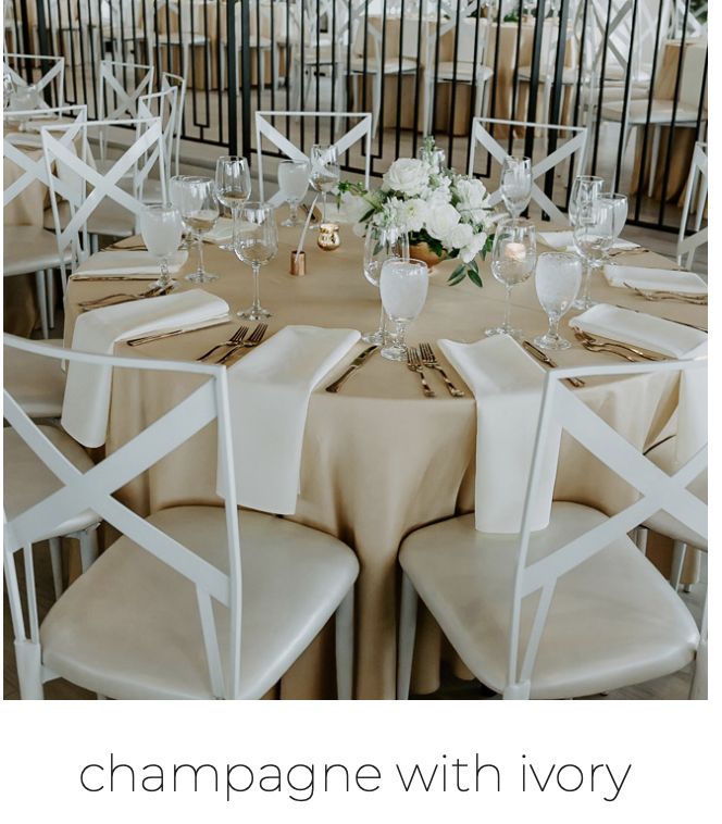 there is a table set up with white chairs