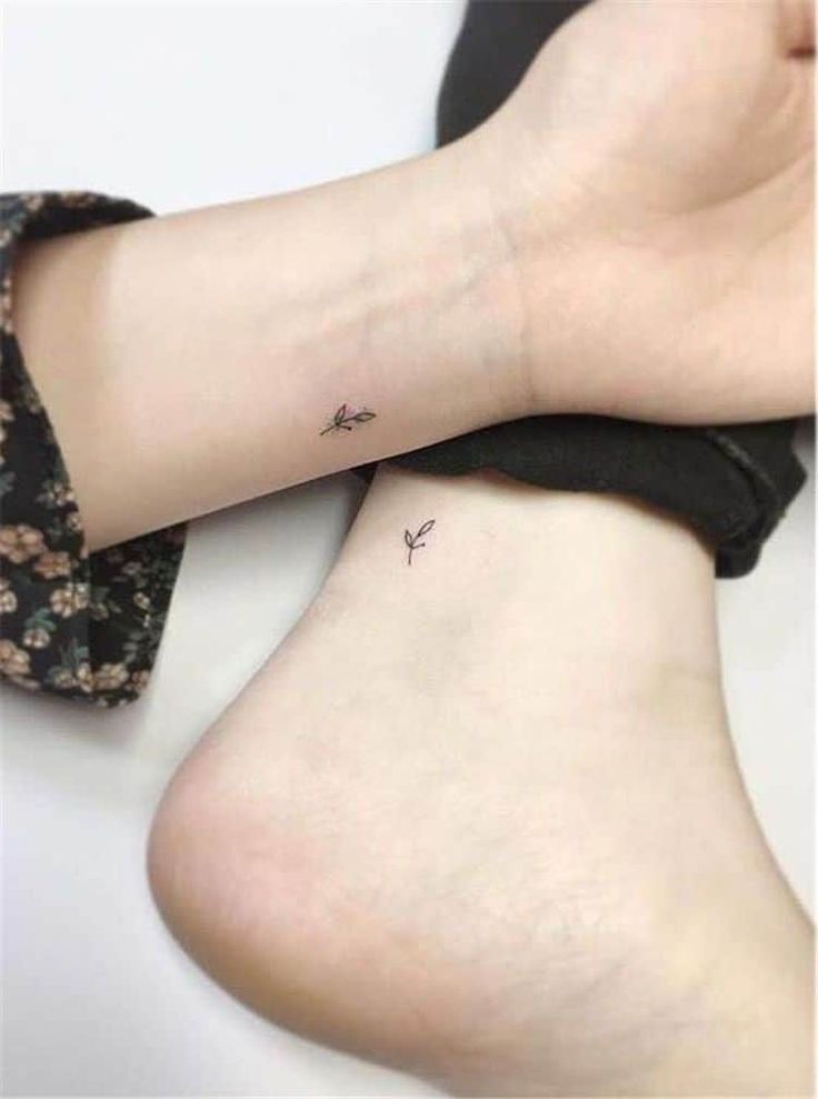 two small tattoos on the legs of women, one with an arrow and another with a bird