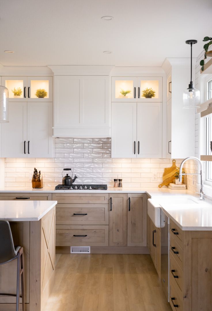 the kitchen is clean and ready for us to use it's counters are white