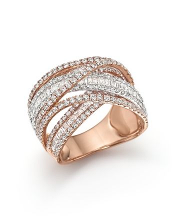 a rose gold ring with white diamonds on the sides and two rows of pave