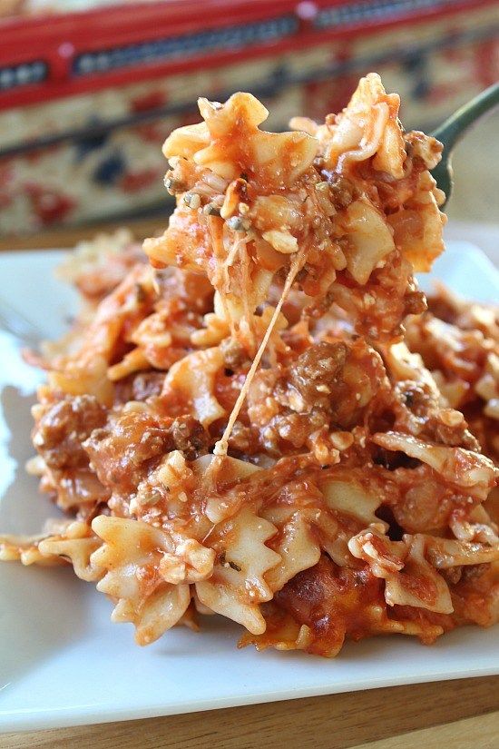 a plate with some food on it and a fork sticking out of the top one