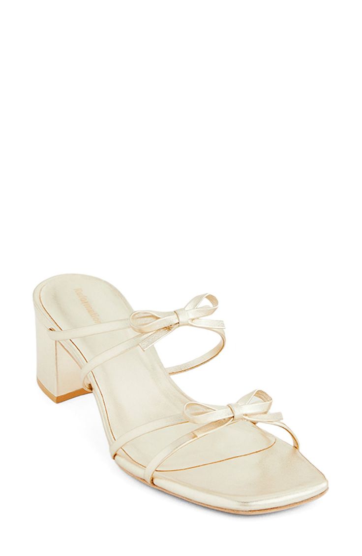 A dainty bow tie punctuates the straps of this glam block-heel sandal fashioned from Brazilian leather. 2" heel (size 9) Adjustable ankle strap with buckle closure Leather upper, lining and sole Made in Brazil Gold Sandals With Open Heel And Gold-tone Hardware, Gold-tone Hardware Block Heel Sandals, Gold Sandals With 4-inch Heel And Medium Width, Gold Sandals With 4-inch Heel Medium Width, Gold Open Toe T-strap Sandals With Buckle Closure, Fabric Gift Bags, Sandal Fashion, Block Heels Sandal, Anniversary Sale