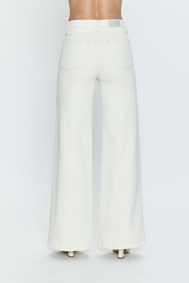 A jean that masters polished and relaxed all at once. The wide leg fit gives a '70s look to the Ecru wash, while the cuff at the floor grazing hem has a chic and refined look. In a comfort stretch fabric, it keeps the structure of the wide leg but still has a touch of give to it. 72% Cotton / 27% Poly / 1% Spandex Imported 70s Look, Ultra Wide, High Hips, Colored Denim, Denim Wash, Warm White, Stretch Denim, Stretch Fabric, Full Length