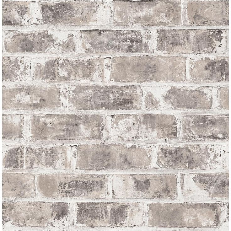 a white brick wall with grey bricks on it