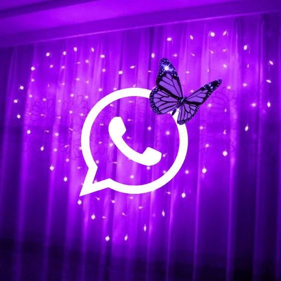 a purple wall with a phone and a butterfly on it