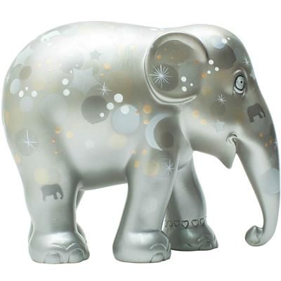 an elephant figurine with stars and sparkles on it's trunk, standing in front of a white background