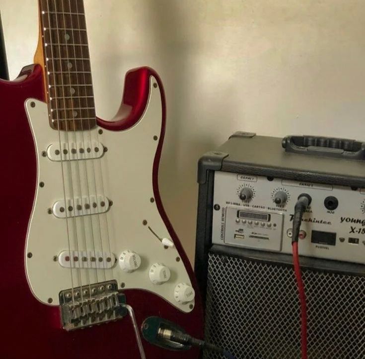 an electric guitar and amp sitting next to each other