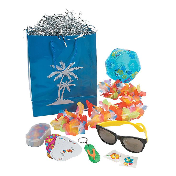 a blue shopping bag filled with confetti, sunglasses and other items to decorate it