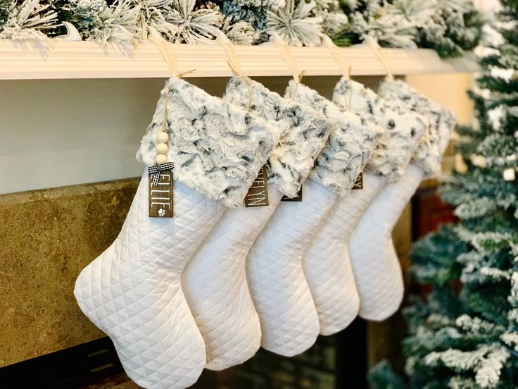 christmas stockings hanging from a fireplace mantel