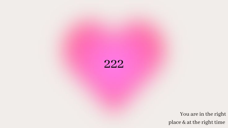 a pink heart shaped object with the words 2232 on it's left side