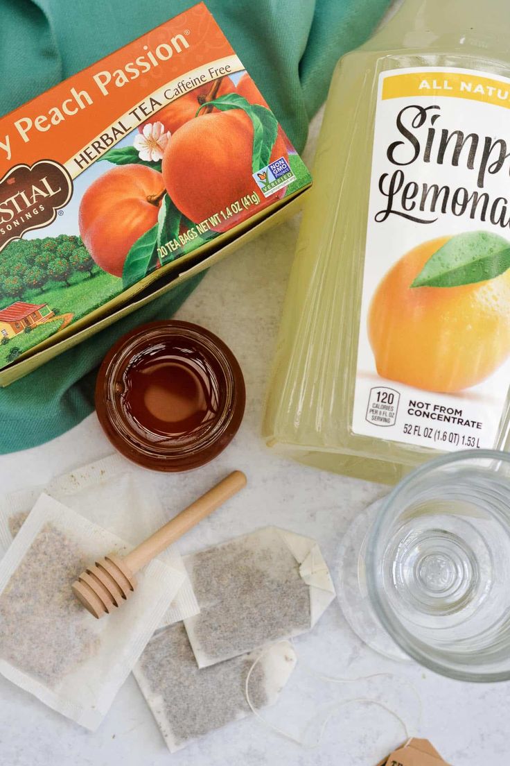 ingredients to make peach tea laid out on a table