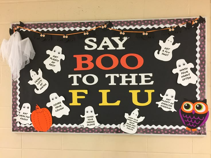 a sign that says say booo to the fluu with owls and ghostes