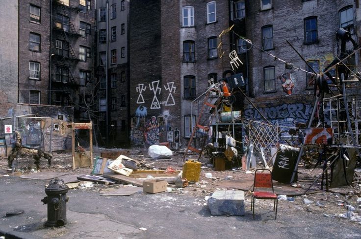 an old city street filled with lots of trash