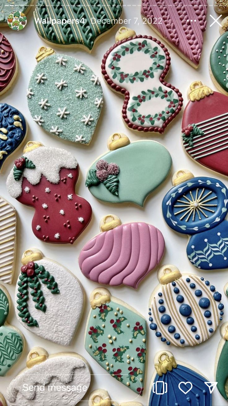 many decorated christmas cookies on a white surface