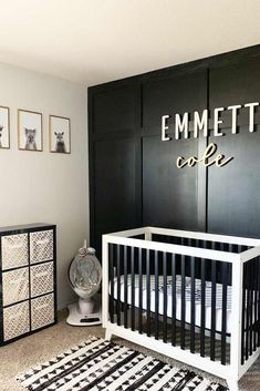 a black and white nursery with an emmet cafe sign above the crib in the corner