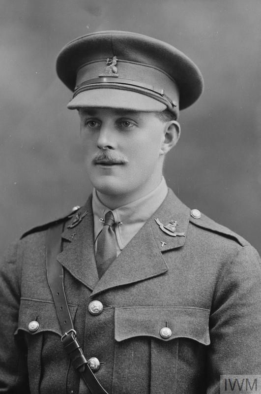 an old black and white photo of a man in uniform