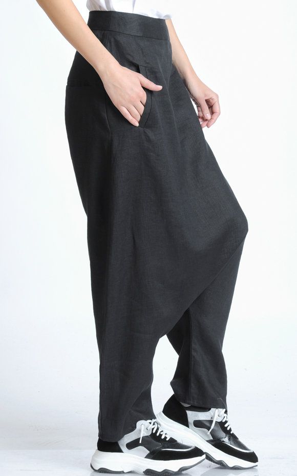 Casual Linen Pants - METP0054 The best look you can ever have is a smile - let us bring it to you with those gorgeous pants! Inspired by the dream of making all of our customers feel special and pamper them, we have created yet another harem style pair of pants - one of our trademarks. Those linen beauties will definitely compliment your style as they are indeed an easy piece to wear and pair with different tops. And not only that, but they also make a great every day garment. The trousers are c Black Wide-leg Harem Pants With Side Pockets, Baggy Black Bottoms For Summer, Baggy Black Summer Bottoms, Baggy Black Harem Pants For Summer, Black Relaxed Fit Ankle-length Harem Pants, Black Baggy Ankle-length Bottoms, Black Relaxed Fit Parachute Pants For Summer, Black Ankle-length Relaxed Fit Harem Pants, Summer Black Relaxed Fit Parachute Pants