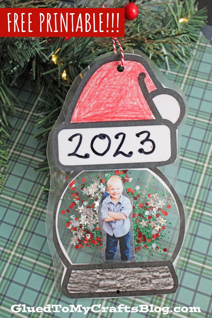 a christmas ornament hanging from a tree with the words 2013 written on it