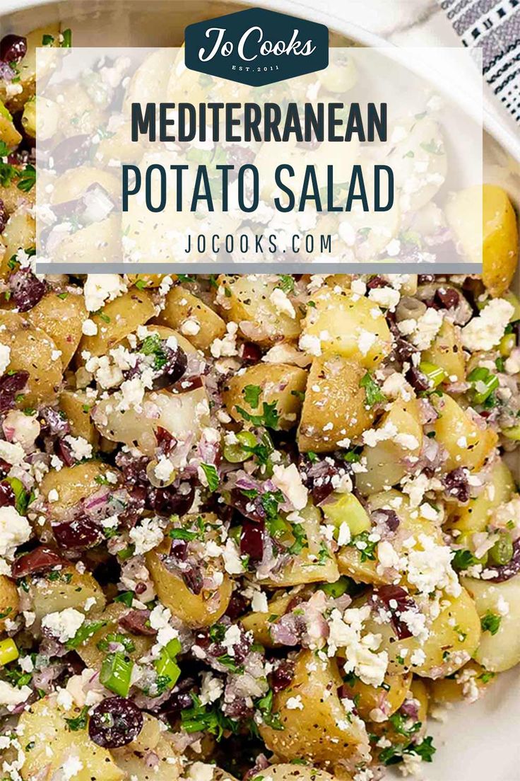 mediterranean potato salad with feta cheese and olives in a white bowl on a table