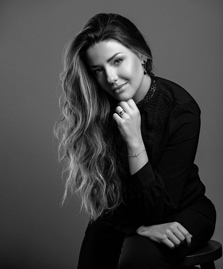 a black and white photo of a woman with long hair