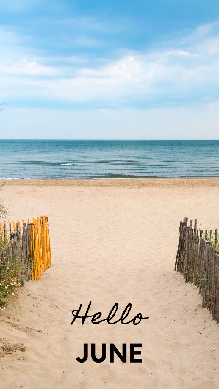 a sandy beach with the words hello june written in black on it and an orange fence at the end