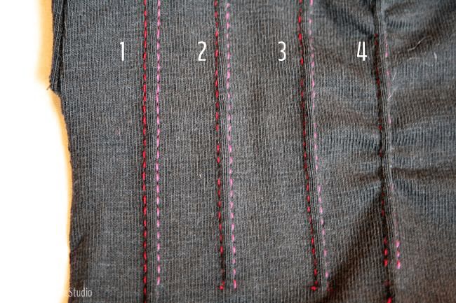 the stitches are marked in red and pink on this piece of clothing that has been stitched together