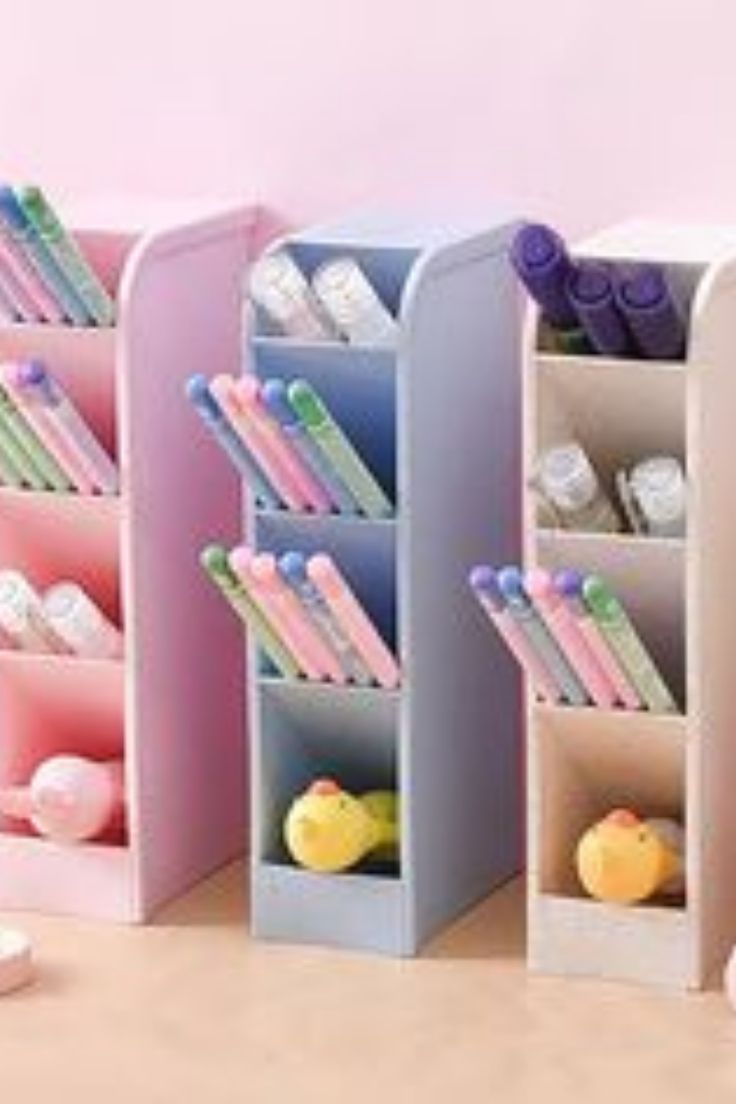 the desk is organized with pens, pencils and an alarm clock