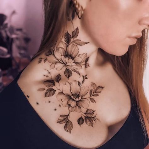 a woman's neck with flowers on it