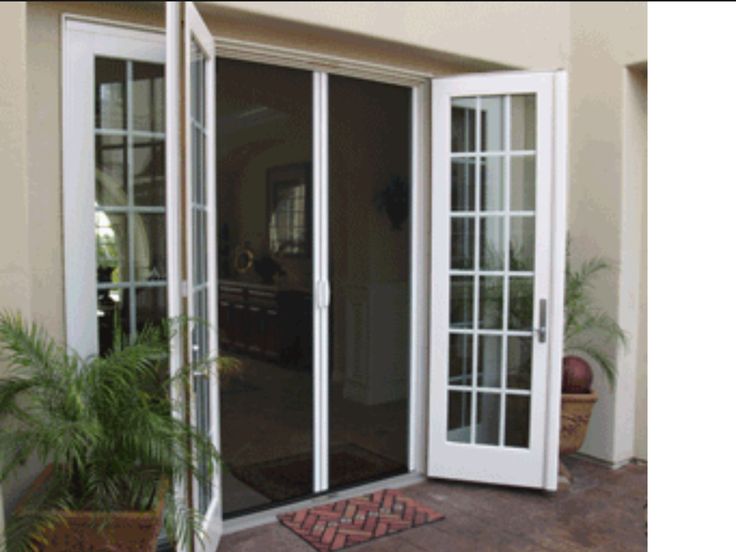 an open patio door with the words out - swing double door retractable screens