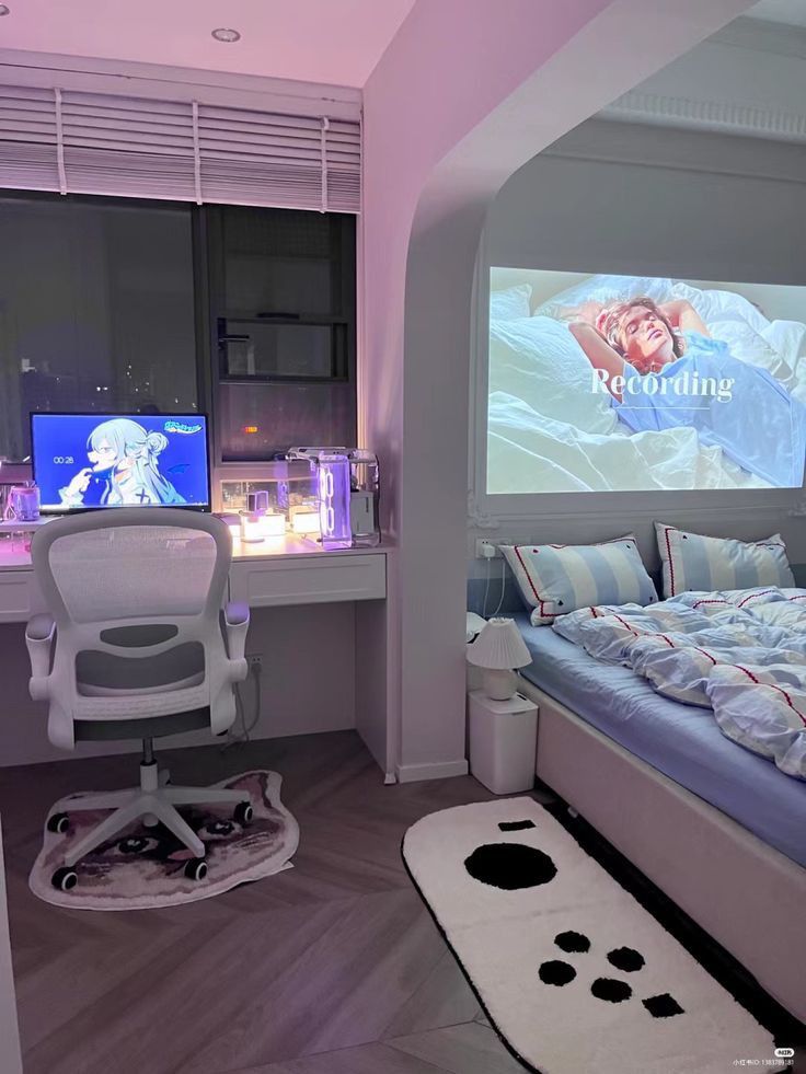 a bedroom with a bed, desk and television in the corner is lit up by purple lighting