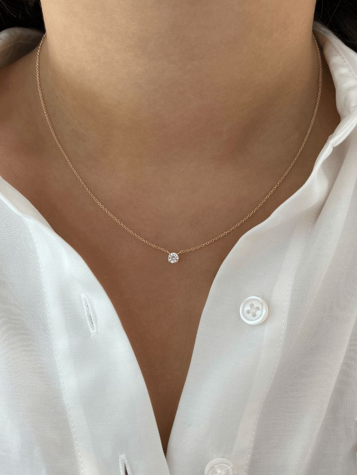 LeMel is known for its dainty gold jewelry and dainty gold necklaces! A timeless necklace you never have to take off! This round diamond necklace is dainty and perfect for layering and gives the illusion of a floating diamond necklace. For a simple and classic look wear this necklace on its own. We love to layer it with a paperclip chain necklace! Minimal Diamond Necklace, Minimalist Accessories Jewellery, Girly Necklace, Round Diamond Necklace, Timeless Necklace, Floating Diamond Necklace, Tennis Jewelry, Royalty Fashion, Dainty Gold Jewelry