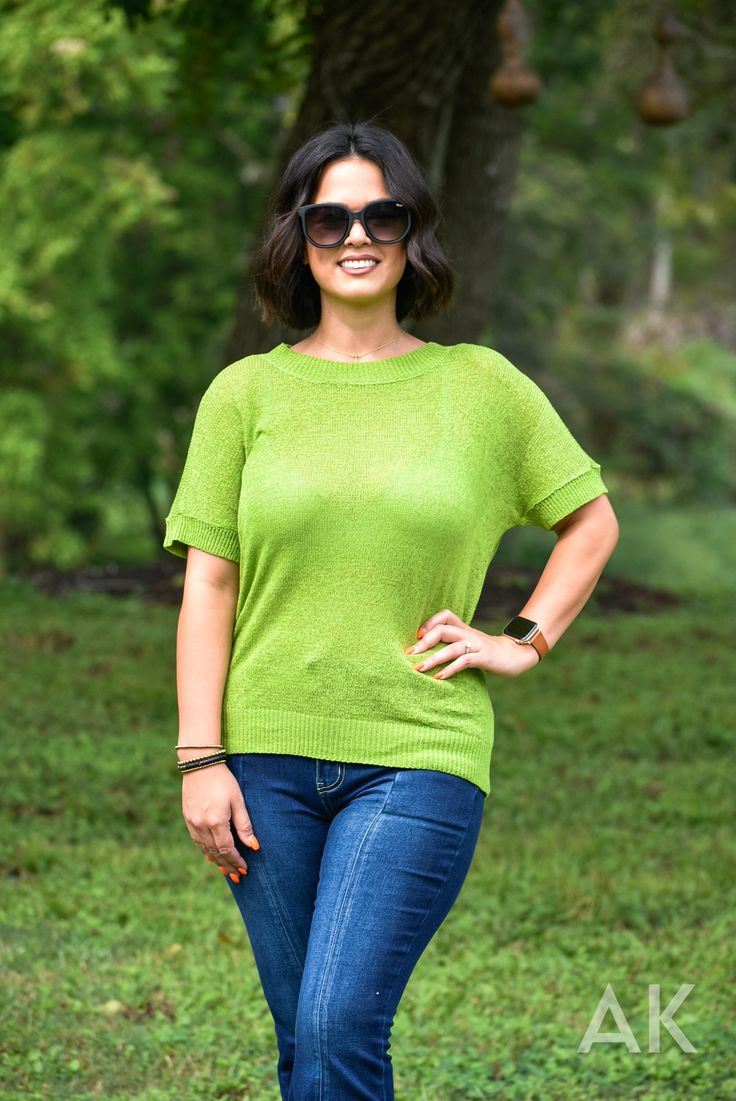 We are loving this bright grass green, short sleeve sweater. It has a soft knit feel with cute ribbed bands on the sleeves, neckline and hem. This fun, bold top is perfect for transitioning from summer to fall! Jessica is wearing a MD. View Model Stats HERE. Knit Roomy Fit 72% Acrylic 28% Nylon Casual Pointelle Knit T-shirt For Spring, Casual Pointelle Knit T-shirt For Summer, Trendy Spring Short Sleeve Crew Neck Top, Green Crew Neck Short Sleeve Top For Summer, Summer Green Short Sleeve Crew Neck Top, Spring Soft Knit Top With Short Sleeve, Spring Fine Knit Stretch T-shirt, Spring Soft Knit Short Sleeve Top, Spring Short Sleeve Top With Ribbed Crew Neck