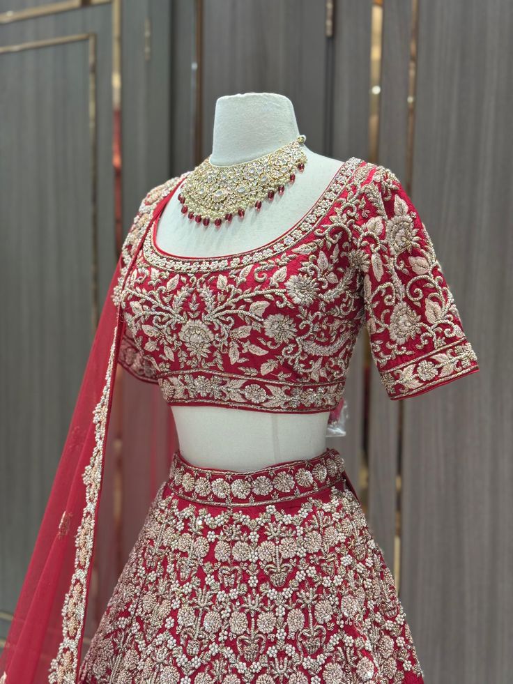 This elegant Radiant Bridal Lehenga BL-009 is crafted with intricate details and luxurious materials. Perfect for any bride looking to radiate beauty and style on her special day. Featuring stunning embroidery and a flattering silhouette, this lehenga is the perfect choice for any traditional wedding. Fabric: Raw Silk! WASH CARE INSTRUCTIONS - Please Dry clean only when it is applicable! Ready to Ship! Festive Embroidered Wedding Dress, Traditional Embroidered Wedding Dress For Festive Season, Traditional Drape Wedding Sets With Dori Work, Wedding Sets With Intricate Kundan Embroidery, Wedding Sets With Intricate Embroidery And Kundan, Traditional Wedding Dress With Intricate Embroidery, Festive Embroidered Wedding Dress For Traditional Ceremonies, Wedding Choli With Intricate Embroidery In Kundan, Traditional Saree Wedding Dress For Reception