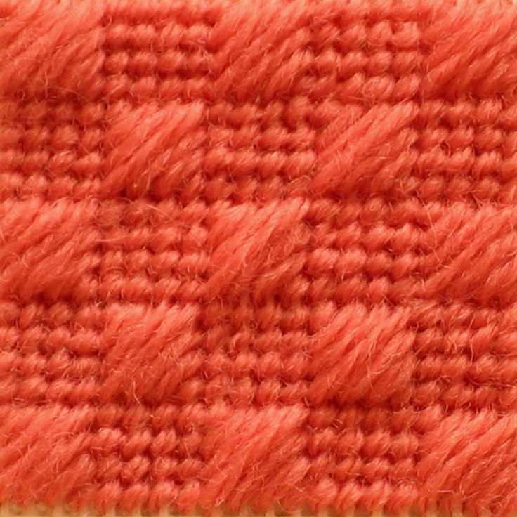 an orange and white checkered fabric textured with wool or flecky yarn