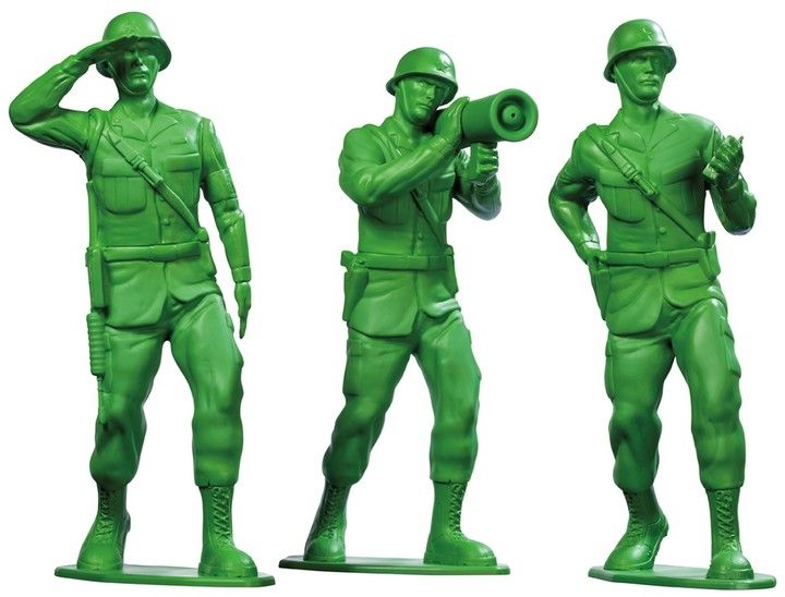 three green plastic soldiers are standing next to each other