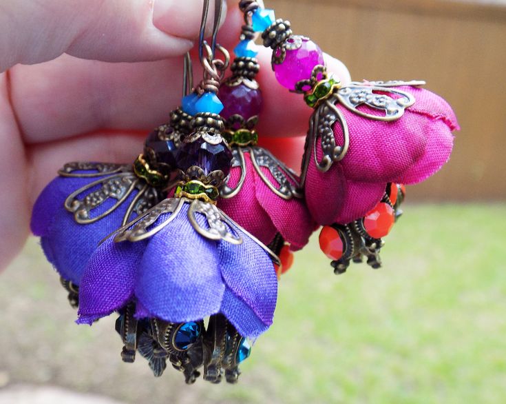 Beautiful and original exclusive design, these flower earrings are wildly ornate. Deepest teal, peacock blue crystals and silky petals in purple with accents of green and teal to top. Fabulously romantic! Handmade Fantasy Earrings For Festivals, Bohemian Brass Flower Earrings, Fairy Earrings, Fantasy Earrings, Flower Purple, Purple Earrings, Earrings Flower, Purple Teal, Silk Flower