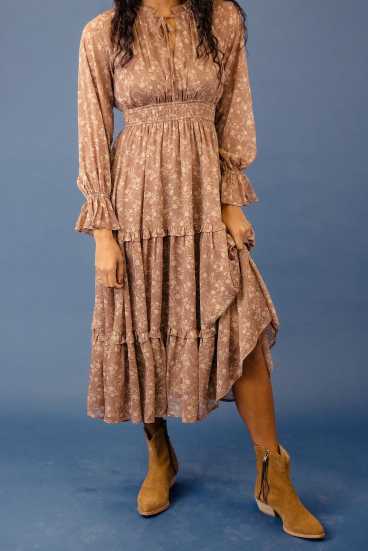 The Santa Fe Sunset Dress is an absolute delight! The tie neckline adds a touch of vintage charm, and those poet sleeves give it a romantic and whimsical feel. But wait, there's more—the tiered skirt adds movement and grace, making it perfect for twirling. fully lined // paired with the free people new frontier western boots in peru *FINAL SALE* Bohemian Tiered Dress With Ruffles For Garden Party, Tiered Dresses For Fall Garden Party, Fitted Bohemian Tiered Dress, Fall Tiered Dresses For Garden Party, Bohemian Tiered Dress With Ruffle Hem For Spring, Bohemian Tiered Skirt Midi Dress For Garden Party, Feminine Flowy Tiered Mini Dress, Cottagecore Tiered Skirt Dress For Garden Party, Spring Cottagecore Tiered Dresses