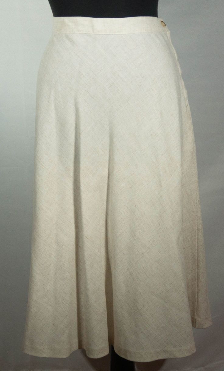 This is a fresh, original and unique rayon, flax and polyester off white, ecru A line boho 1970's vintage Sears label midi skirt. This vintage wardrobe staple, keeper of a neutral skirt is very well constructed. It has a high waist band and hidden zipper and button closure with a hemline that falls below the knees. It also has a wonderful leisure boho 70s look and the great collectible vintage SEARS label. It is in great pre-loved vintage condition with normal signs of wear/use and no major dama Bohemian A-line Summer Bottoms, Spring Bohemian A-line Bottoms, Classic Off White Bottoms For Spring, Spring Cream A-line Bottoms, White Linen Knee-length Bottoms, Spring A-line Bohemian Bottoms, Bohemian A-line Bottoms For Spring, White Knee-length Linen Bottoms, Cream Knee-length Bottoms For Summer