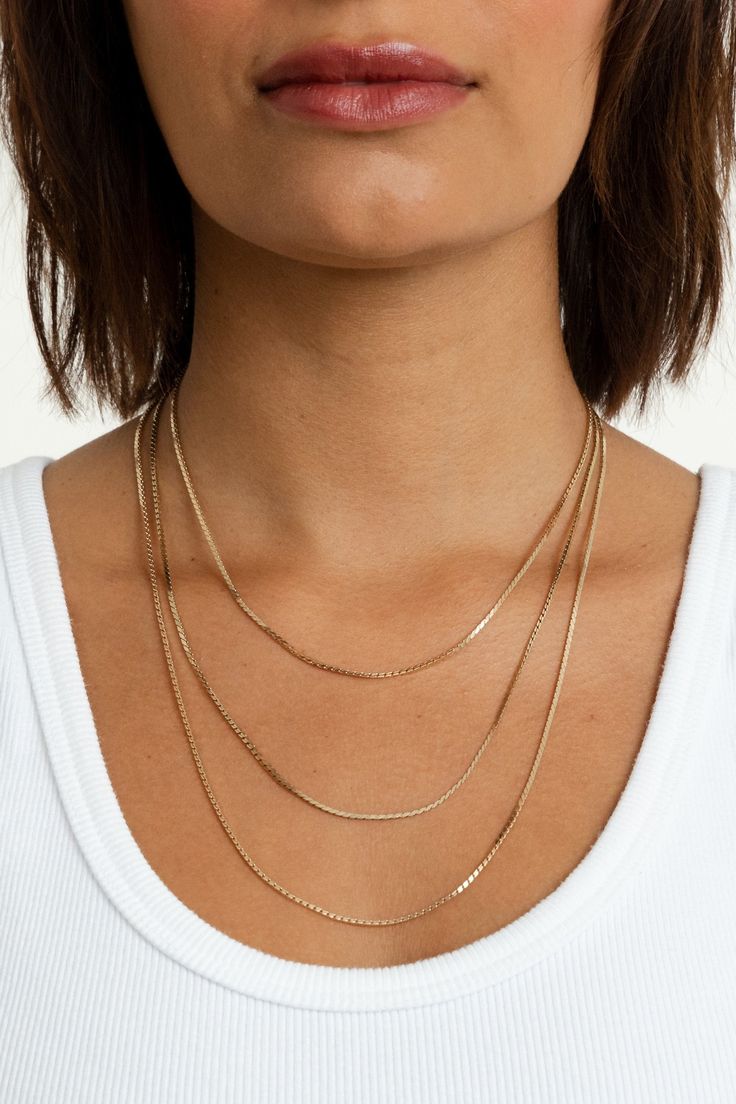 Add a charm or wear it on its own—the Bowie Chain is perfect for both layering and wearing solo. Its versatile design makes it an essential piece for any jewelry collection, effortlessly transitioning from a subtle accent to a standout statement. 18k gold-plated brass 2mm chain width Available in 3 lengths 15" - 16" 18" - 19" 21" - 22" **Does not pair with the Gianna, Harlyn, Radiant, Scarlett, or Pave Initial Charms 14k Gold Charm Necklace With Box Chain, 14k Yellow Gold Charm Necklace With Box Chain, Timeless Delicate Chain Necklace In Rose Gold, Yellow Gold Recycled Gold Jewelry With Box Chain, Dainty Layered Snake Chain Necklace, Adjustable Yellow Gold Chain Necklace In Recycled Gold, 14k Gold Filled Chain Necklace For Layering, Everyday Gold Plated Box Chain Necklace, Dainty Double Chain Everyday Jewelry