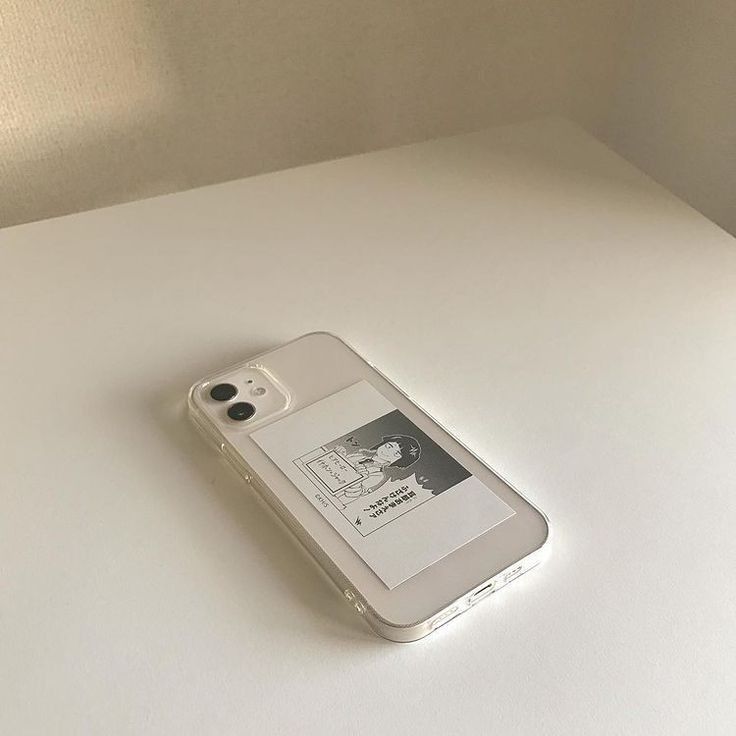 an iphone case sitting on top of a white table