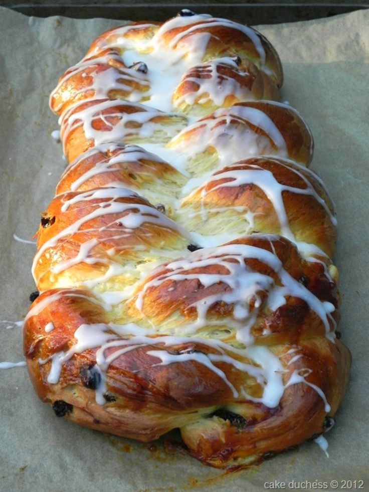 the bread is covered with white icing and blueberries