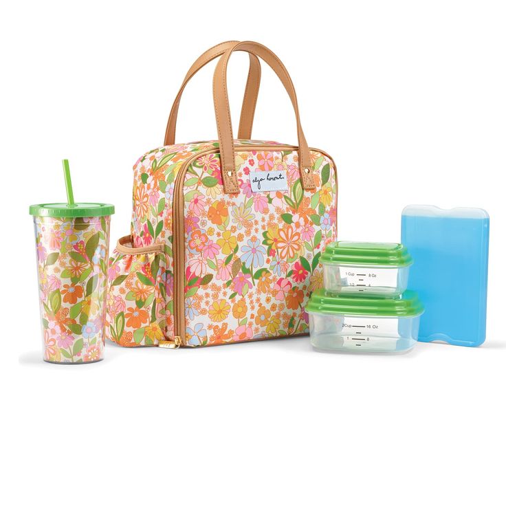 a floral lunch bag with two cups and one container next to it, on a white background