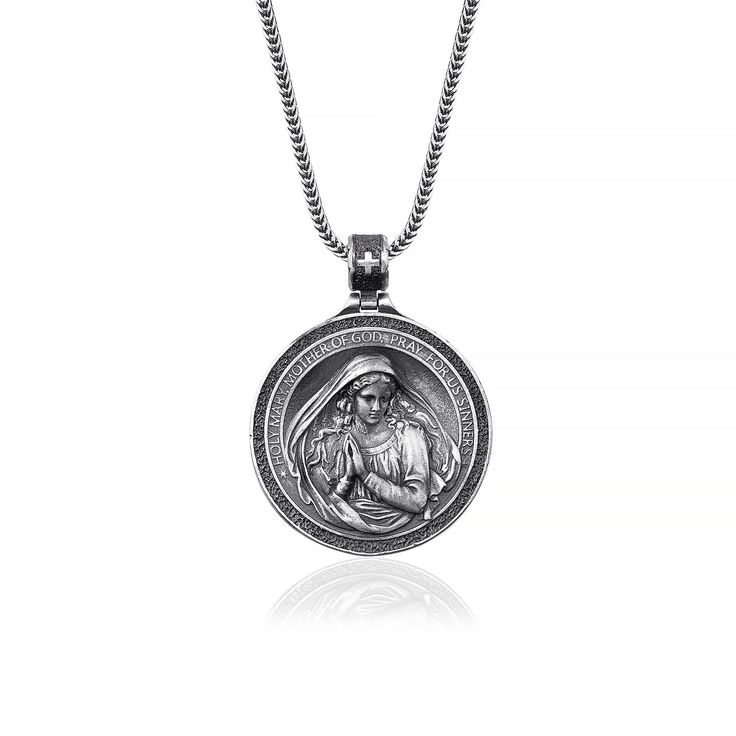 Introducing the Miraculous Virgin Mary Necklace. This beautiful piece is handmade from high quality 925 sterling silver and makes a stunning addition to any jewelry collection. The intricate details and craftsmanship are truly remarkable and the necklace is sure to become a treasured keepsake. The Virgin Mary is a powerful symbol of faith and protection and wearing this necklace is a wonderful way to show your devotion. Whether you choose to keep it for yourself or give it as a gift, the Miracul Sterling Silver Medallion Necklace With Silver Clasp, Spiritual Engraved White Gold Jewelry, Engraved Spiritual White Gold Jewelry, Engraved White Gold Spiritual Jewelry, Sterling Silver Medallion Necklace With Polished Finish, Antique Silver Sterling Silver Round Pendant Necklace, White Gold Medallion Necklace With Sterling Silver Clasp, Symbolic Silver Necklace With Sterling Clasp, Antique Silver Spiritual Jewelry