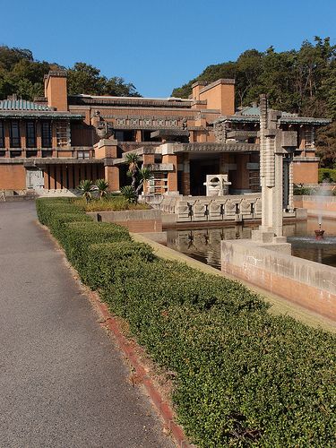 a large building with a fountain in front of it