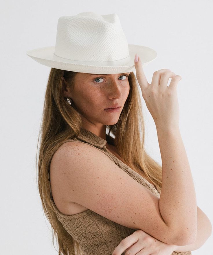 The iconic Panama hat. The Lupe’s short upturned brim combined with a classic fedora crown make it a timeless summer style. This hat includes a genuine leather band with for an elevated accent. Handwoven panama straw is lightweight, making this style an ideal travel companion. Chic Short Brim Sun Hat For Everyday, Chic Everyday Sun Hat With Short Brim, Modern Fedora For Summer, Modern Curved Brim Hats For Summer, Summer Panama Hat With Short Brim For Everyday Use, Modern Brimmed Summer Hats, Modern Summer Fedora Hat, Modern Summer Hat With Curved Brim, Modern Flat Brim Summer Hat