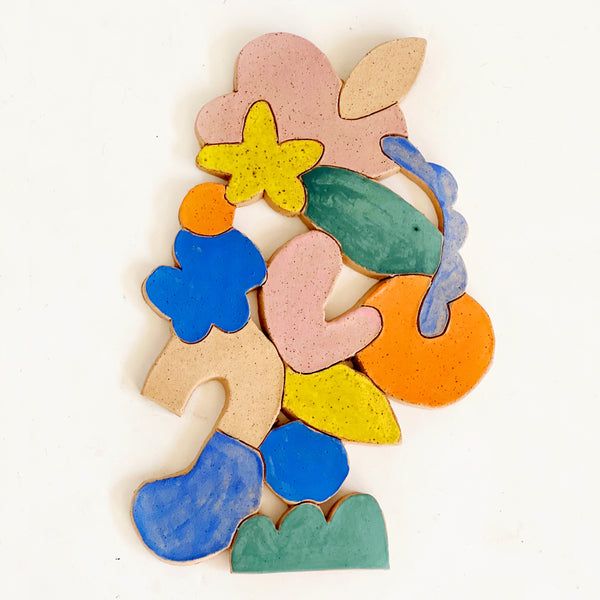 a group of colorful wooden shapes sitting on top of each other